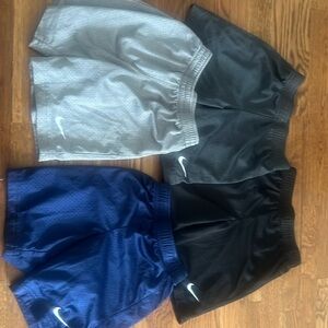 four pairs of nike shorts. - black, light grey, dark grey and navy